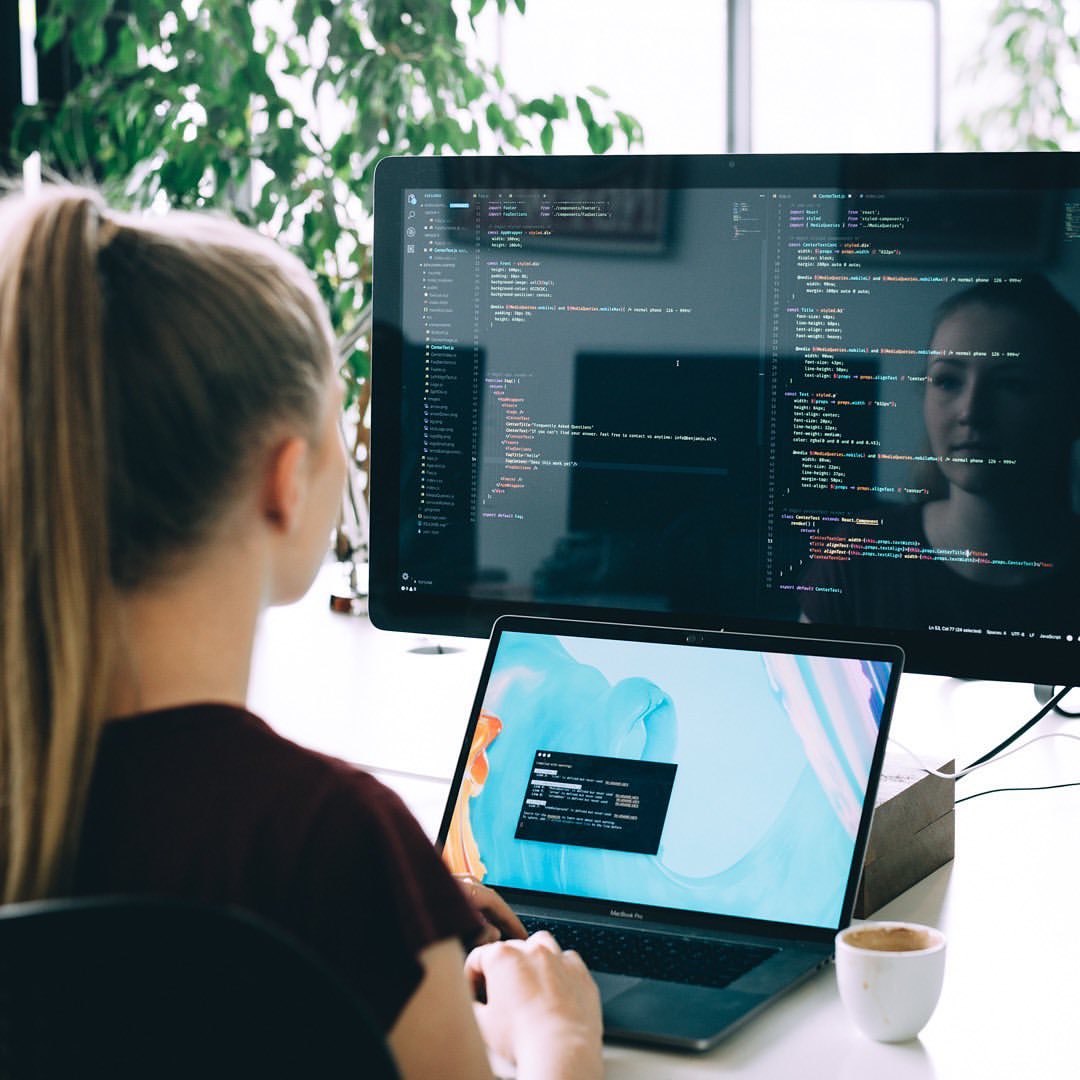 Web designer at work writing code