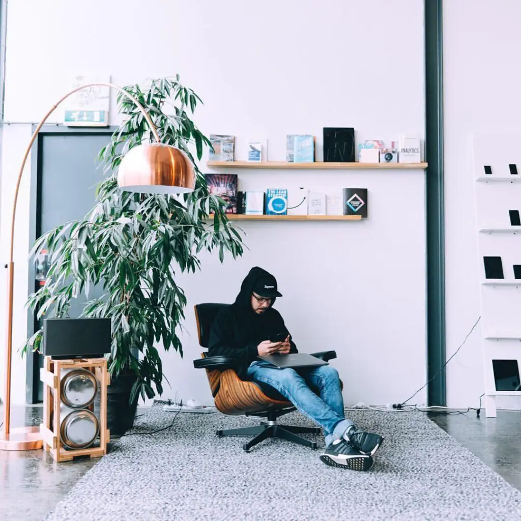 Marketer sitting in Eames Lounge Chair