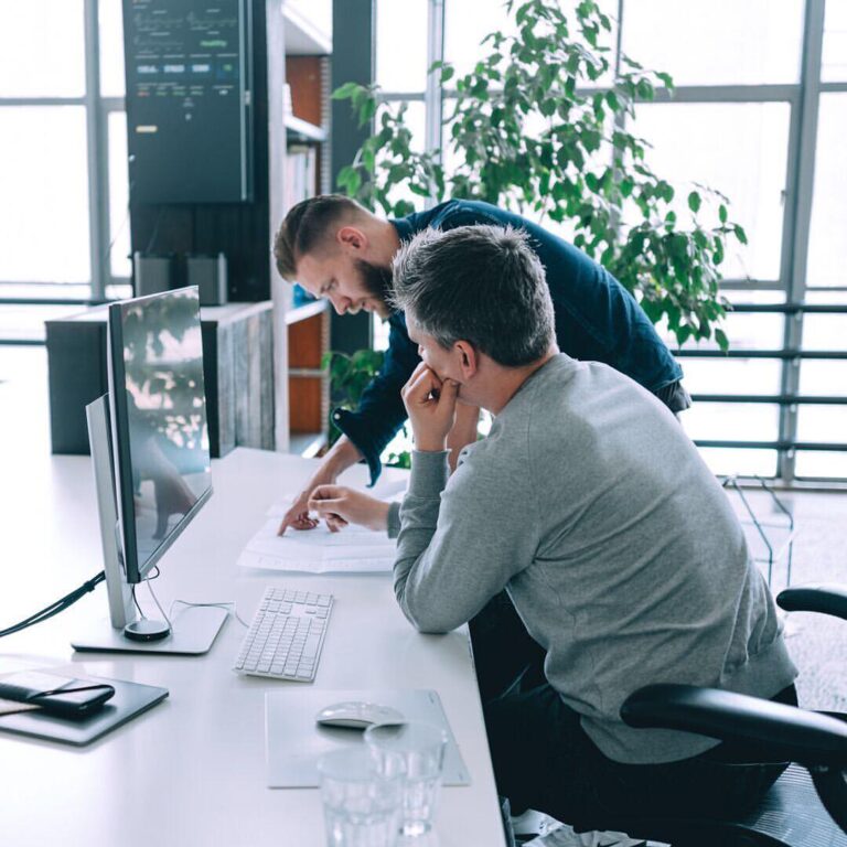 Two digital marketers designing an ad campaign for a medical spa